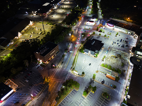 Aerial drone view of a suburban retail/dining/service area.