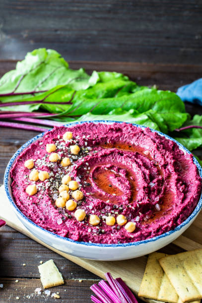 istock Red beetroot hummus with fresh vegetables and Olive oil 1414287050