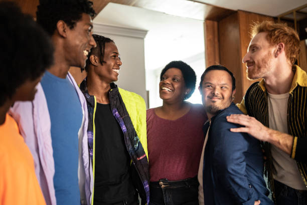 istock Friends talking and embracing at home 1414287403