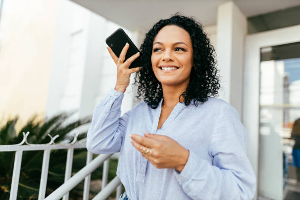 istock Businesswoman using smartphone in the city. 1414287672