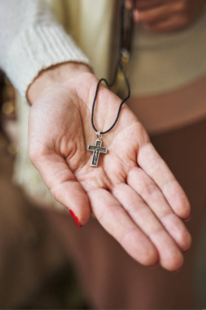 istock Orthodox cross on a woman's palm 1414288780
