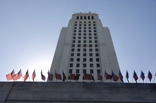 Los Angeles municipal building with 20 flags waving