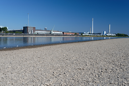 Cologne, Germany August 11, 2022: The Ford Motor Company in cologne at low water levels on the rhine