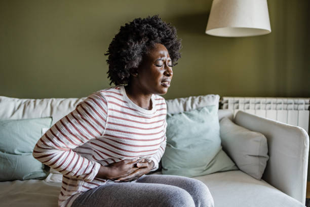 istock Young woman having a stomach ache 1414297717