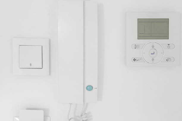 istock light switch, intercom handset, room air conditioning and full card light switch (card switch). Entrance to the room, apartment. Electronics in the house 1414297759