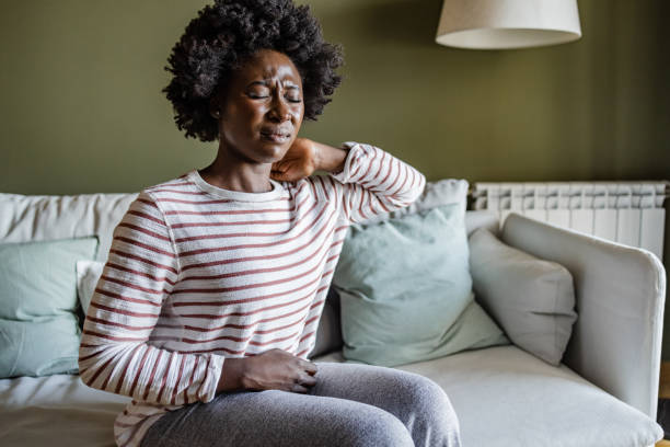 istock Young woman having neck pains 1414297766