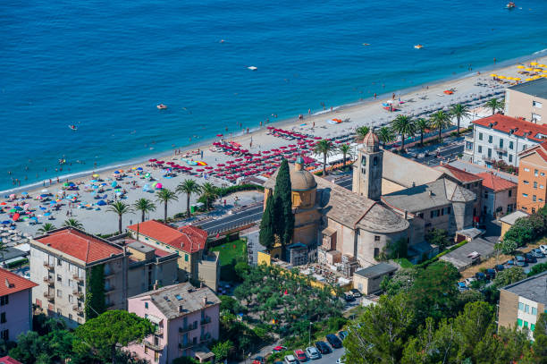 Church and beach of  Varigotti Church of the village of Varigotti, facing the beach finale ligure stock pictures, royalty-free photos & images