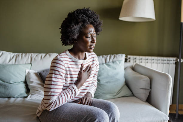 istock Young woman having chest pains 1414297926