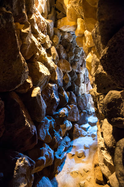 istock Dark tunnel in stone cave 1414300214