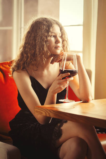 istock girl with wine 1414304001