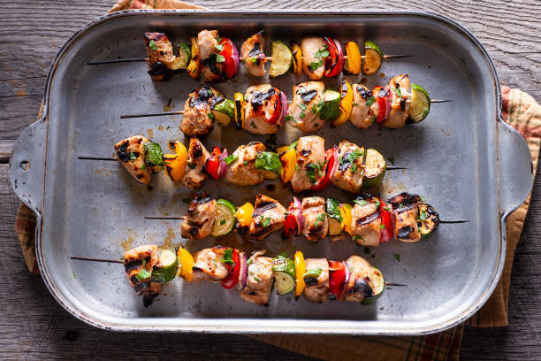 Chicken Kebabs Grilled Chicken Kebabs (Kabobs) with Red and Yellow Bell Peppers, Zucchini and Red Onion chicken skewer stock pictures, royalty-free photos & images