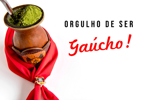 Traditional red hanky and yerba mate tea, chimarrão gaucho from southern Brazil on white background.