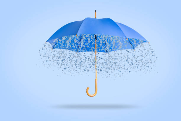 istock Blue umbrella with raindrops on a blue background 1414305396