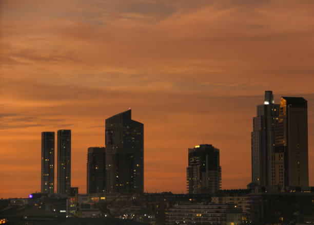 istock sunset with buildings on the horizon 1414306756