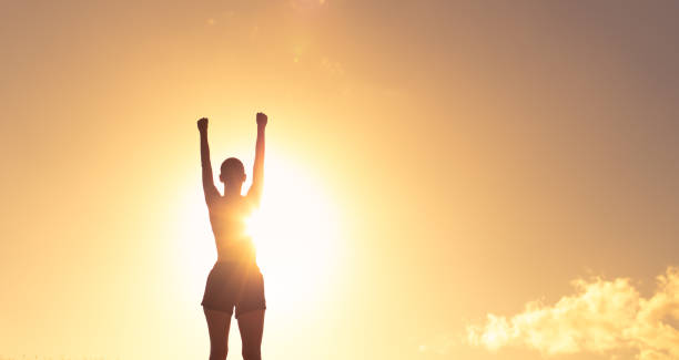 istock Strong woman at sunset 1414308092