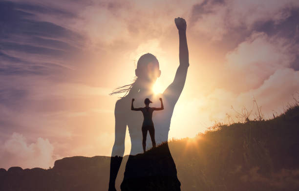 istock Woman flexing her arms in the air 1414308204