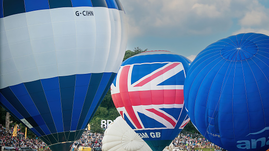 a brightly covered hot air balloon with a banner for your test