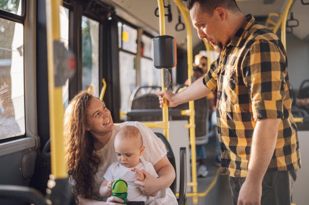 istock Parents riding a bus with their child during a day. 1414309219