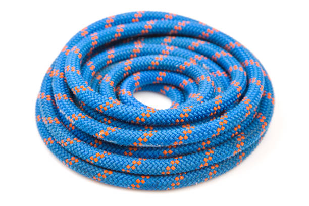 Yellow coiled rope in a spiral isolated on white background.