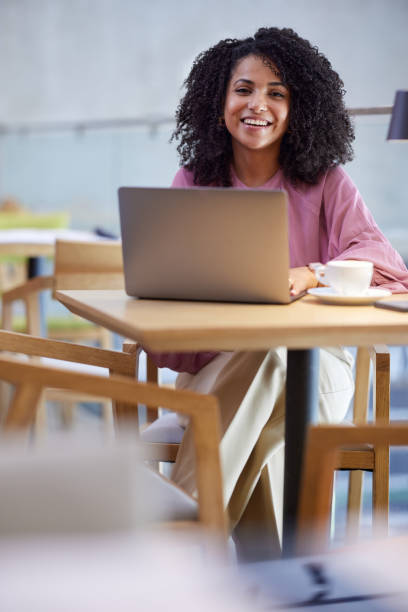istock A freelancer sits in a cafe, typing on the laptop. 1414314444