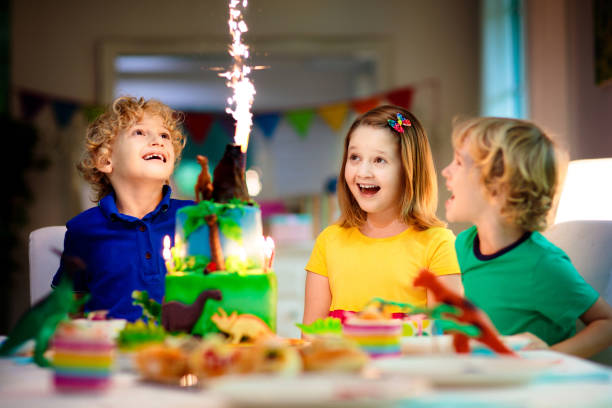 istock Kids birthday party. Dinosaur theme cake. 1414314575