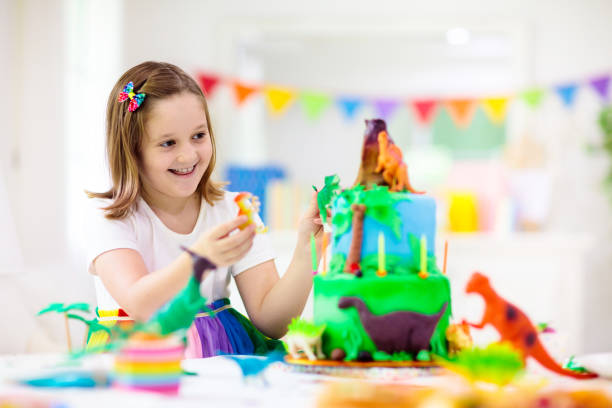 istock Kids birthday party. Dinosaur theme cake. 1414314681