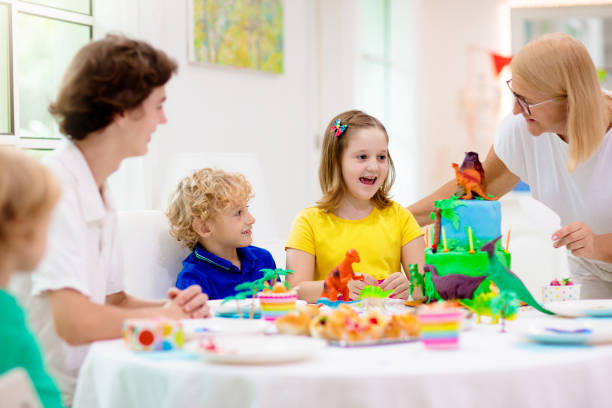 istock Kids birthday party. Dinosaur theme cake. 1414317159