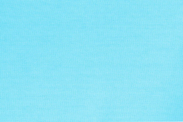 istock Blended cotton silk fabric textile wallpaper detailed texture pattern background in sweet light pale cyan blue color 1414317255
