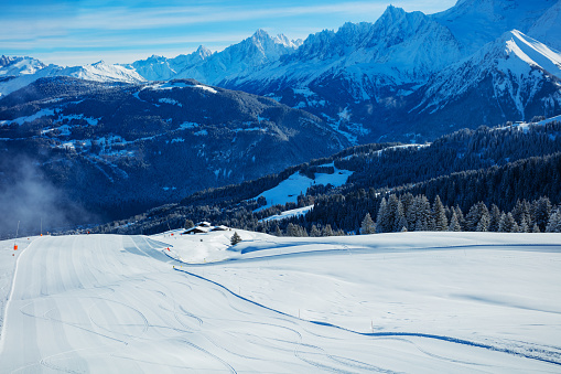 Fresh beautiful ski track over the Mont Blanc Alps massif mountains range on sunny morning