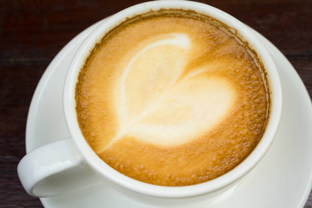 A cup of hot latte coffee cup ,close up.