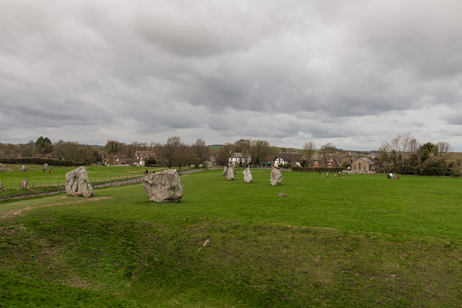 Avebury, UK - Mar 18, 2019:  The iconic Avebury Stone Circle mid day.