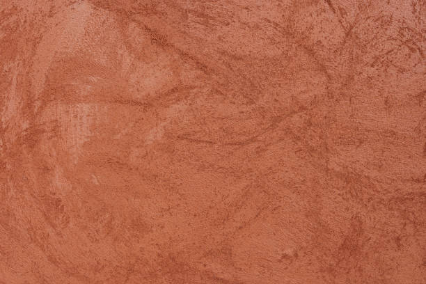 Orange-brown cement wall texture background, wallpaper abstract grunge pattern surface retro backdrop.