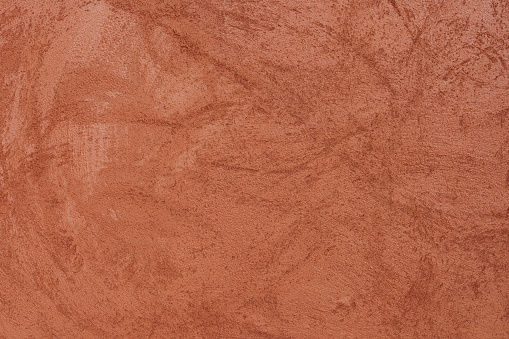 Orange-brown cement wall texture background, wallpaper abstract grunge pattern surface retro backdrop.