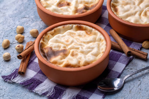 istock Baked rice pudding turkish milky dessert sutlac in earthenware casserole with hazelnuts 1414321256
