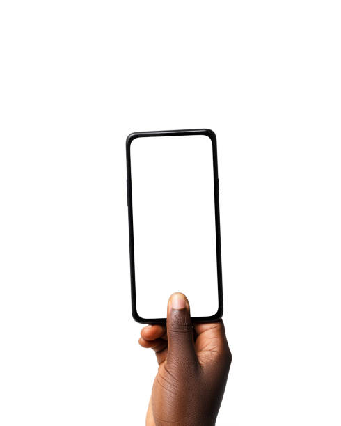 istock Black hand holding and pressing phone screen facing camera isolated on white background. blank screen, phone screen mockup, front view, clipping path, clipping mask 1414323994