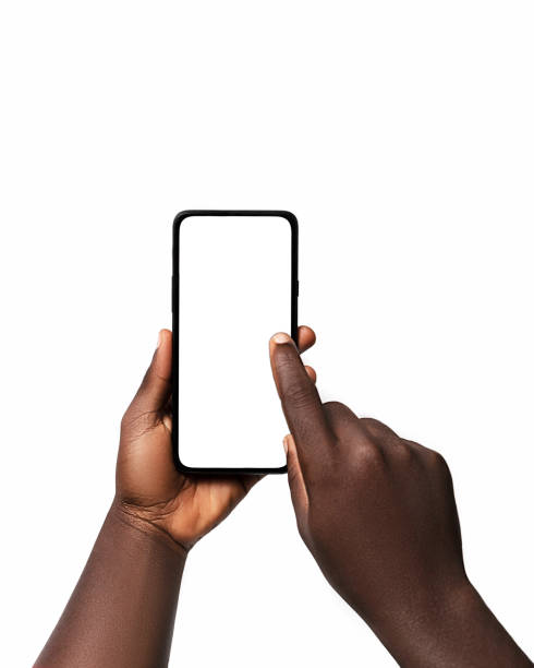 istock Black hand holding and pressing phone screen facing camera isolated on white background. blank screen, phone screen mockup, front view, clipping path, clipping mask 1414324037