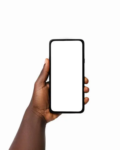 Black hand holding phone facing camera isolated on white background. blank screen, phone screen mockup, front view, clipping path, clipping mask