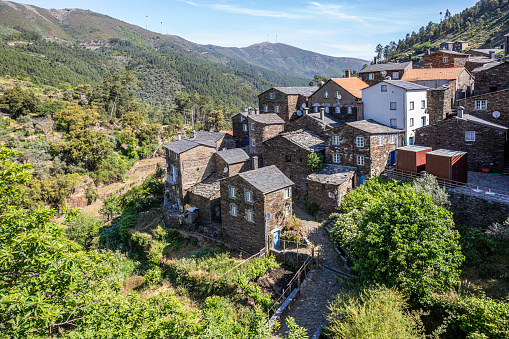 This village in the mountains of Portugal is made almost entirely of schist rock. The schist houses are capped with slate roofs, their colors causing them to blend in with the stone pathways that wind among the buildings.
