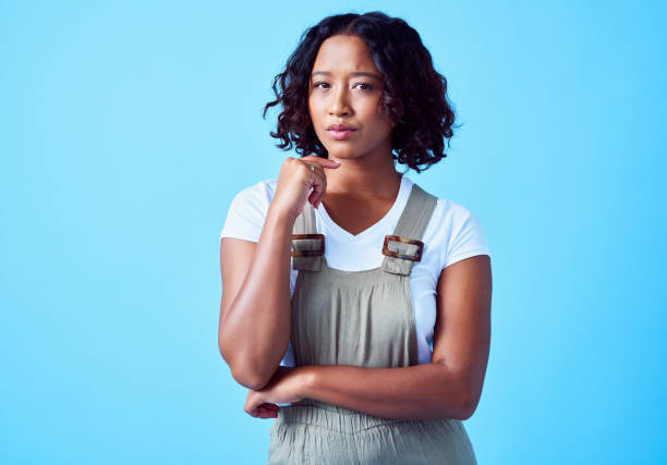 istock Suspicious, skeptical and thoughtful woman thinking of choice, decision or offer while looking puzzled, doubtful and unsure. Indecisive, pensive and confused lady being serious, critical and curious 1414324449