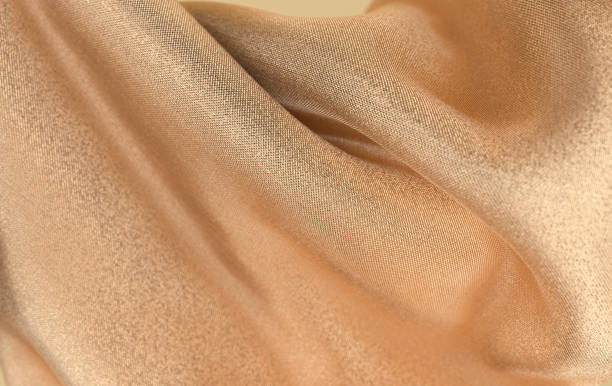 istock Luxury soft textile fabric in motion  3d render. Abstract modern golden cotton 3d background 1414328492