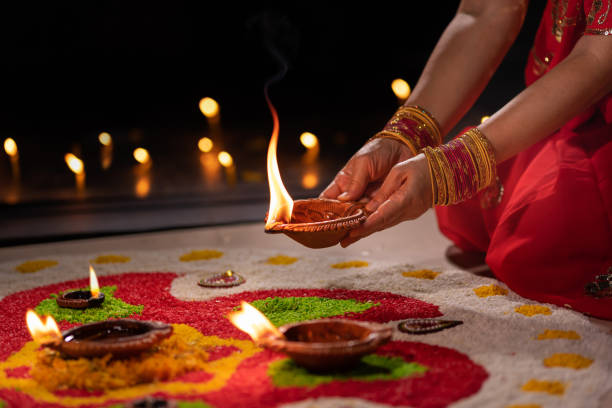 Traditional diya lamps lit during diwali celebration stock photo
