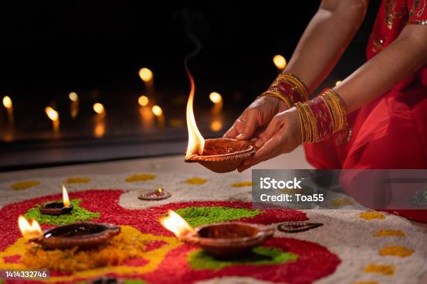 Traditional Diya Lamps Lit During Diwali Celebration Stock Photo - Download Image Now