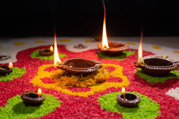 istock Traditional diya lamps lit during diwali celebration 1414332771