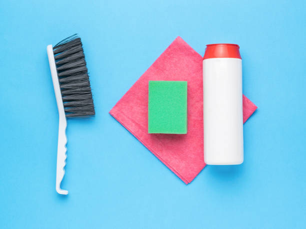 istock Brush, sponge, rag and cleaner on a blue background. Cleaning kit. 1414333643