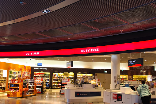 Frankfurt am Main, Germany - May 09, 2022: The people at Heinemann duty free shop inside of Frankfurt am Main Airport