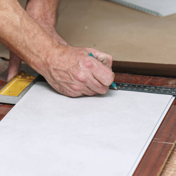 istock The worker marks the plastic panel with a pencil and tape measure or ruler 1414339932