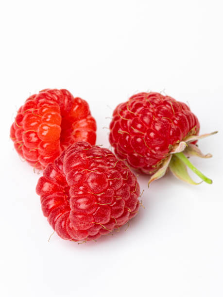 istock set of raspberries isolated on white background 1414348943