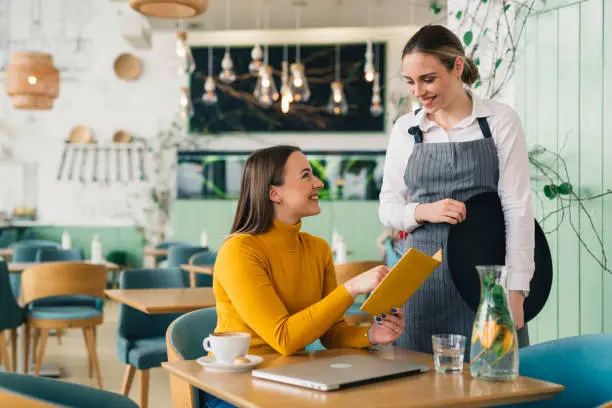 woman ordering food in restaurant