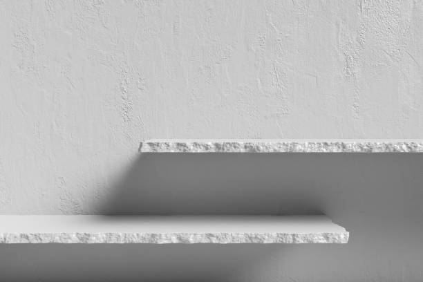Shelves and white concrete walls modern minimal rough surface texture wall loft style. Advertising display pedestal space placing products cosmetics book art and other.