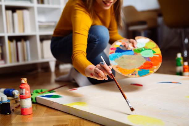 istock woman making paint at home 1414353506